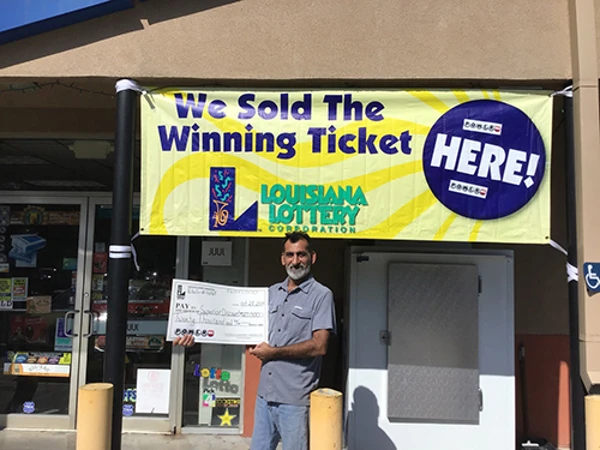 Ali Zadi, owner of Superior Discount, receives store's $20,000 lottery bonus 