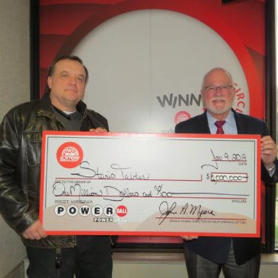 Powerball Winner Stanis Tabler with West Virginia Lottery Director John Myers